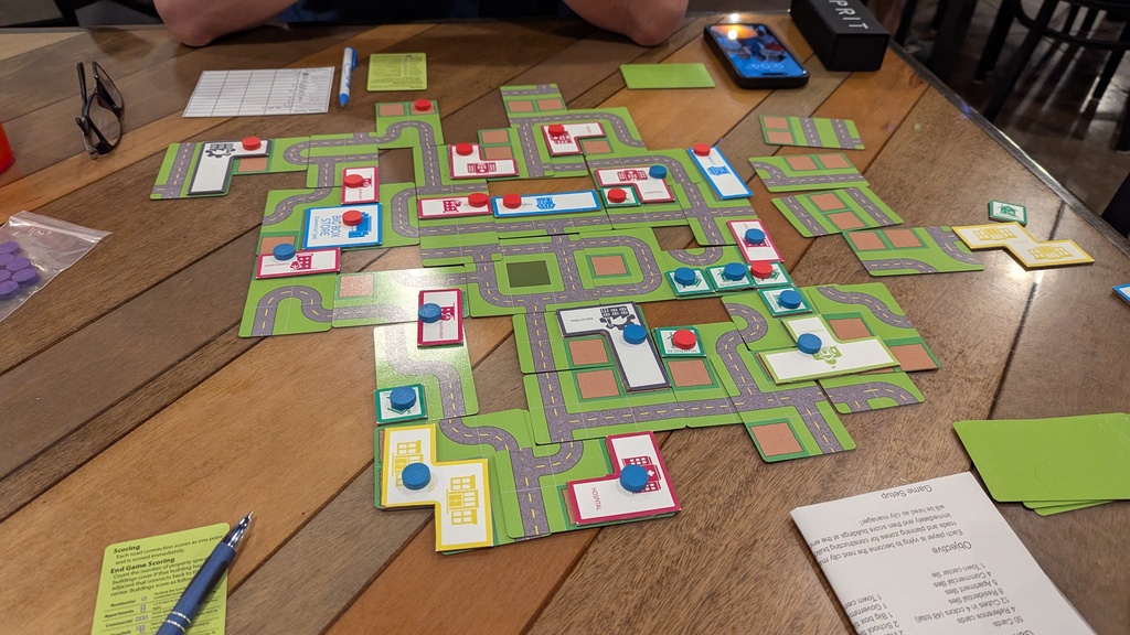 Close up image of the cards and tiles with cubes on top of the building tiles.